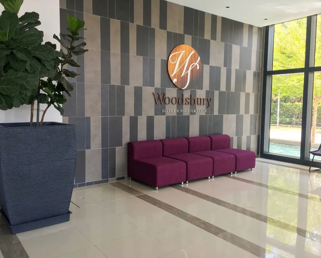 Sunset sea and city view from a Woodsbury Suites living room in Butterworth Penang